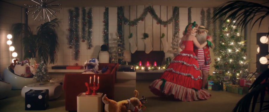 Katy Perry dancing with Santa Claus in front of the Christmas tree near the end of the music video. 