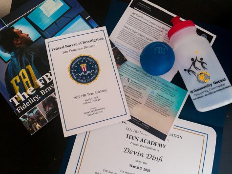 Items, information, and a certificate that I received from attending the FBI Teen Academy. There was a white hazmat suit passed out, but it is not pictured. 