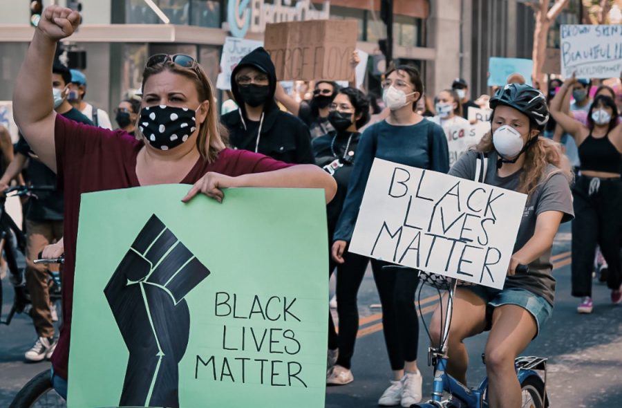 Justice for George Floyd protest occurring with protestors holding signs saying Black Lives Matter in Downtown San Jose on Friday, May 29, 2020. 